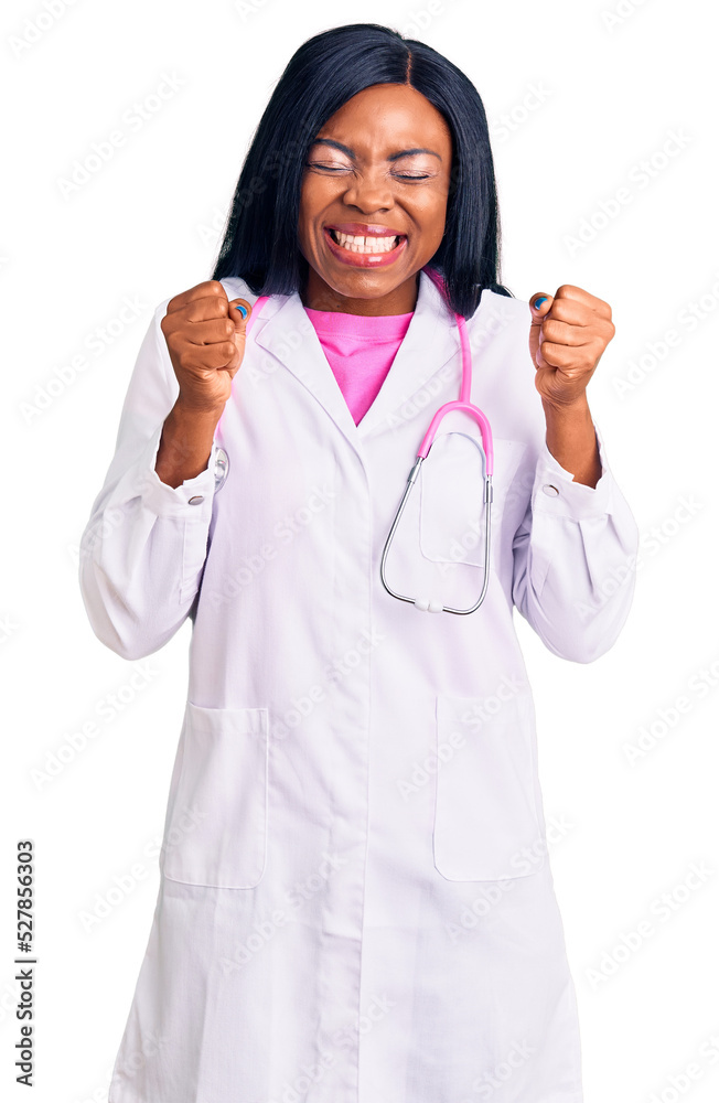 Young african american woman wearing doctor stethoscope excited for success with arms raised and eyes closed celebrating victory smiling. winner concept.