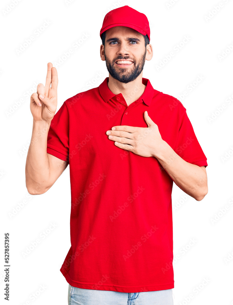 Young handsome man with beard wearing delivery uniform smiling swearing with hand on chest and fingers up, making a loyalty promise oath Young handsome man with beard wearing delivery uniform smiling swearing with hand on chest and fingers up, making a loyalty promise oath