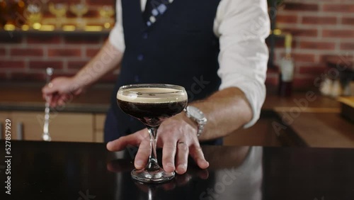 barman preparing espresso martini cocktail