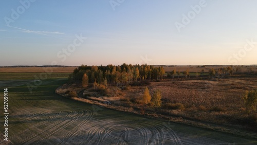 Aerial top view photo from flying drone of a land with down fields in countryside.