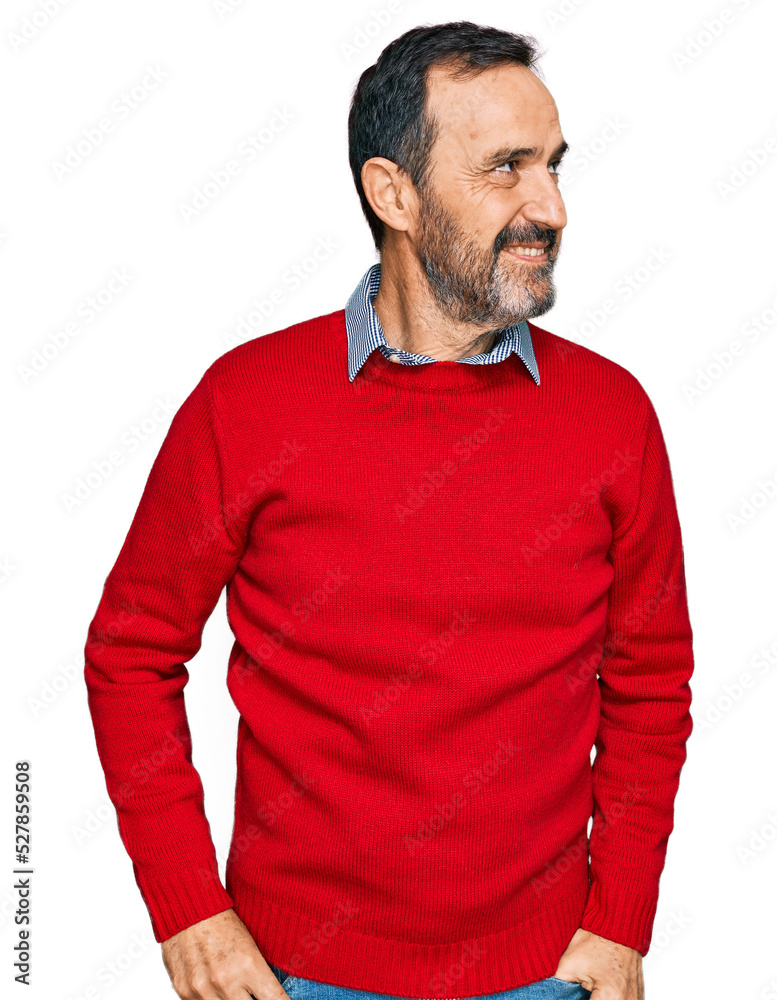 Middle age hispanic man wearing casual clothes looking away to side with smile on face, natural expression. laughing confident.