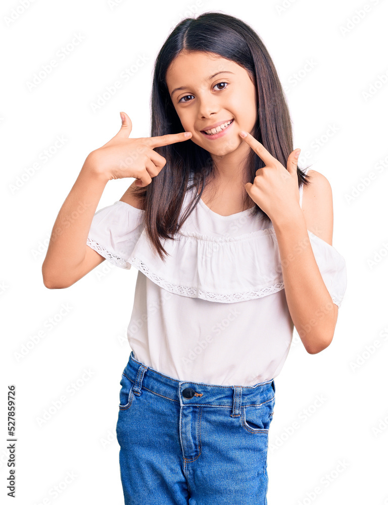 Beautiful child girl wearing casual clothes smiling cheerful showing and pointing with fingers teeth and mouth. dental health concept. Beautiful child girl wearing casual clothes smiling cheerful showing and pointing with fingers teeth and mouth. dental health concept.