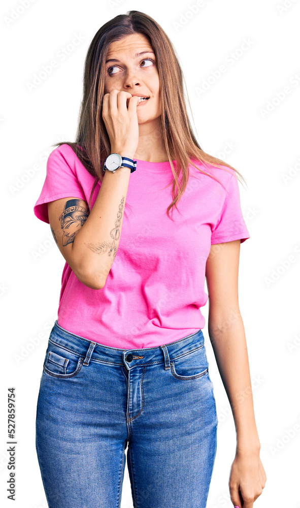Beautiful caucasian woman wearing casual clothes looking stressed and nervous with hands on mouth biting nails. anxiety problem. Beautiful caucasian woman wearing casual clothes looking stressed and nervous with hands on mouth biting nails. anxiety problem.