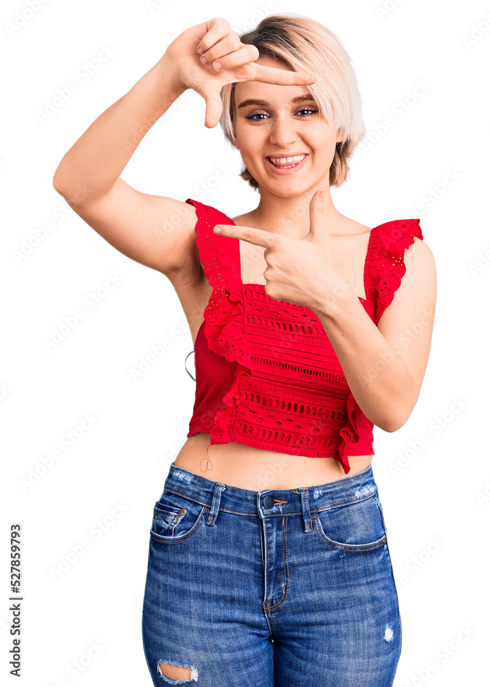 Young beautiful blonde woman wearing casual clothes smiling making frame with hands and fingers with happy face. creativity and photography concept. Young beautiful blonde woman wearing casual clothes smiling making frame with hands and fingers with happy face. creativity and photography concept.