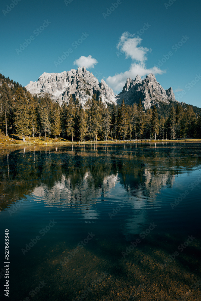 lake reflection in the dolomites at summer time