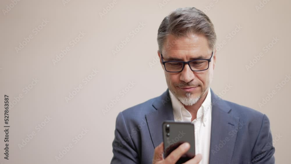 Middle age businessman in business casual using phone. Entrepreneur in jacket. Mid adult, mature age man, happy smiling. Portrait isolated on white. Middle age businessman in business casual using phone. Entrepreneur in jacket. Mid adult, mature age man, happy smiling. Portrait isolated on white.