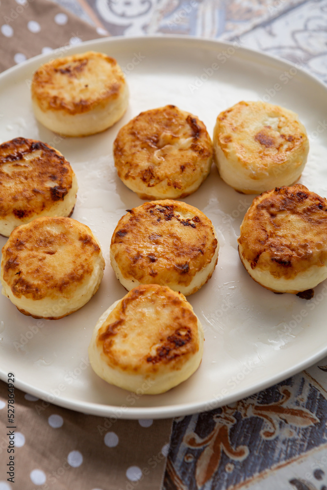 Close up of fresh cheeese pancake fritters breakfast food Close up of fresh cheeese pancake fritters breakfast food