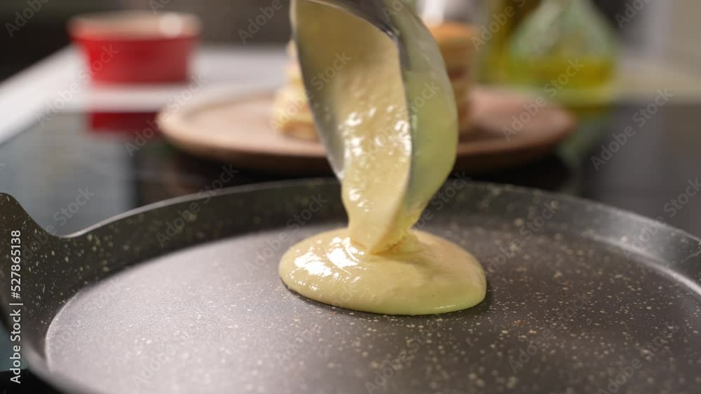 Pancake cooking process in a frying pan. Close up shot of spatula flipping pancake in hot frying pan. Making pancake homemade recipe pancake for family delicious breakfast meal.High quality 4k footage Pancake cooking process in a frying pan. Close up shot of spatula flipping pancake in hot frying pan. Making pancake homemade recipe pancake for family delicious breakfast meal.High quality 4k footage