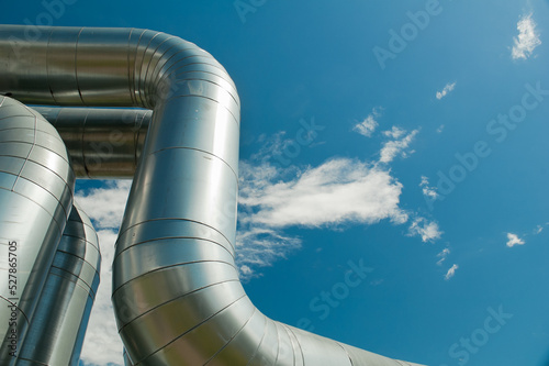 pipeline, in the photo pipeline close-up against the background of blue sky and clouds © fotofotofoto
