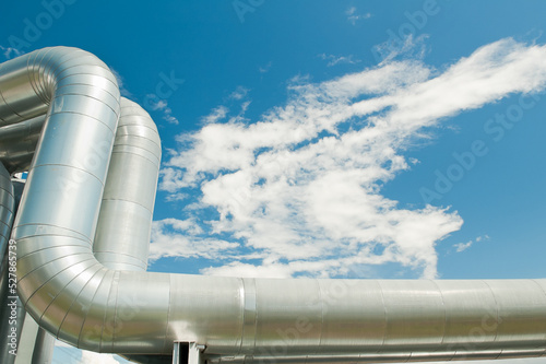 pipeline, in the photo pipeline close-up against the background of blue sky and clouds