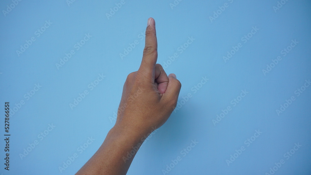 Man pointing at something on white background, closeup of hand Man pointing at something on white background, closeup of hand