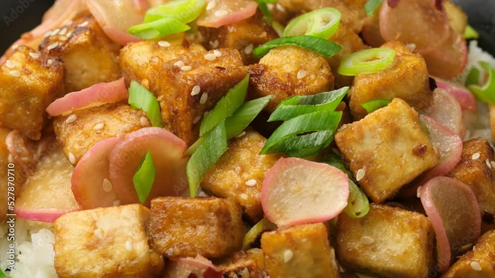 Fried tofu with radish, spring onion and garlic, ginger dressing. Rotating video Fried tofu with radish, spring onion and garlic, ginger dressing. Rotating video
