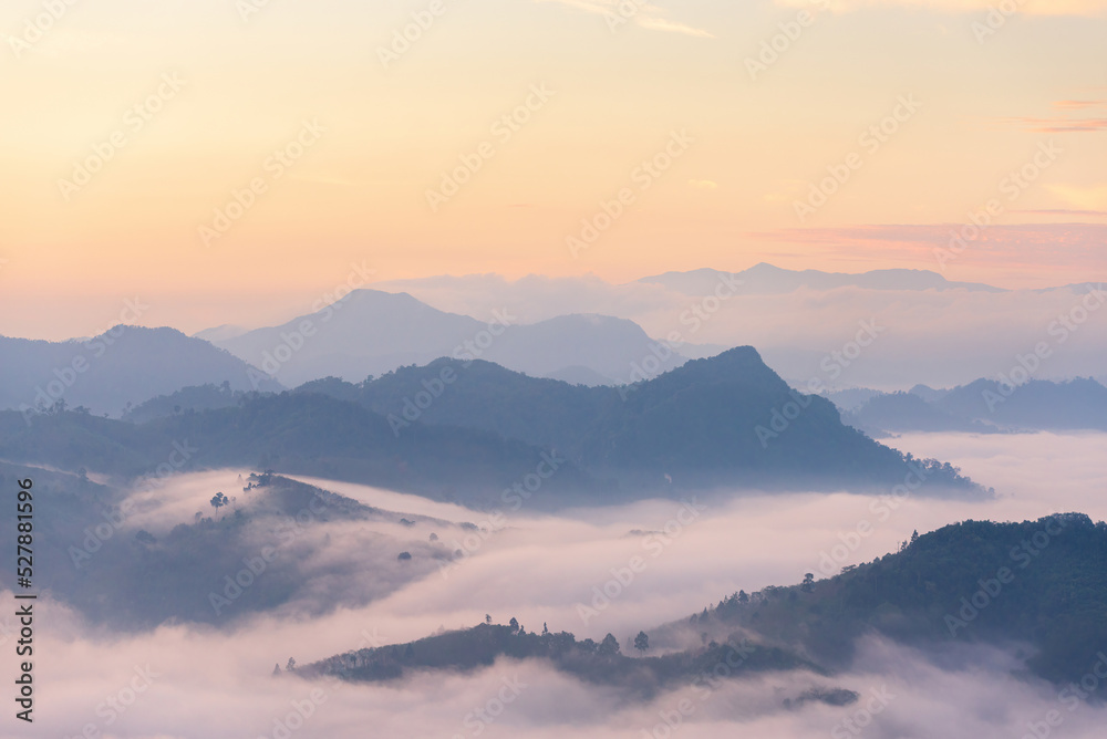 Sea of mist in the rainforest, sky and mountains at dawn.