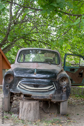 old rusty pink passenger car