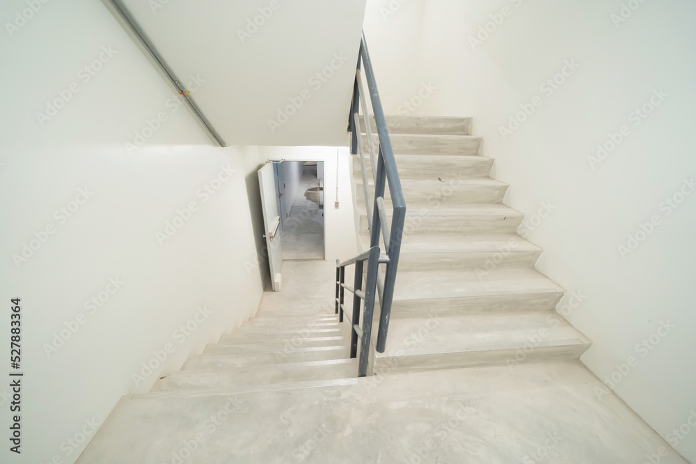Fototapeta premium Empty fire exit staircase in hotel. Architecture interior design decoration.
