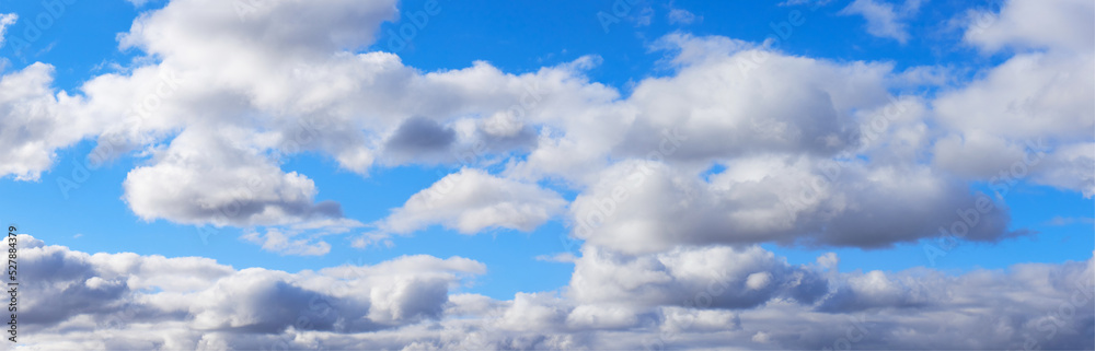 Widescreen panorama of blue sky with white clouds