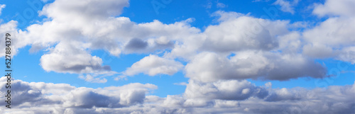 Widescreen panorama of blue sky with white clouds