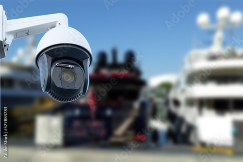 security CCTV camera or surveillance system with Marina on blurry background.