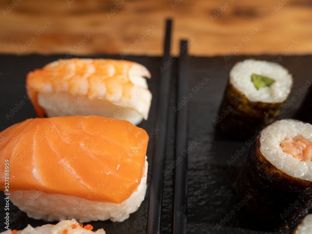 Japanese kitchen. Sushi on a dark background. Japanese kitchen. Sushi on a dark background.