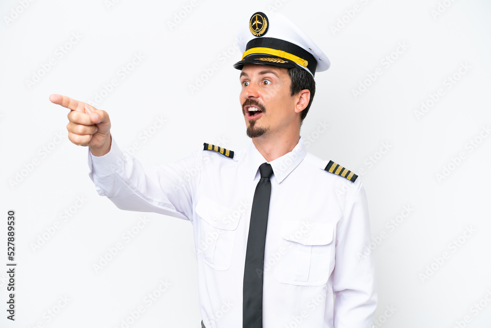 Airplane caucasian pilot isolated on white background pointing away Airplane caucasian pilot isolated on white background pointing away