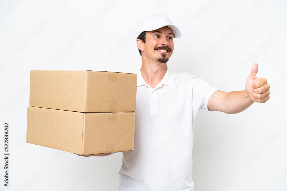Delivery caucasian man isolated on white background giving a thumbs up gesture Delivery caucasian man isolated on white background giving a thumbs up gesture