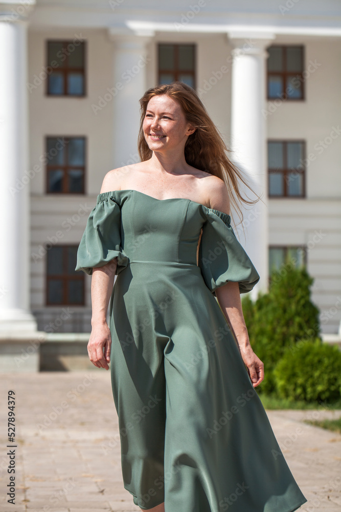 Fototapeta premium Portrait of a red-haired young woman