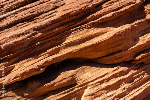 Abstract background of rocky formation with uneven texture photo