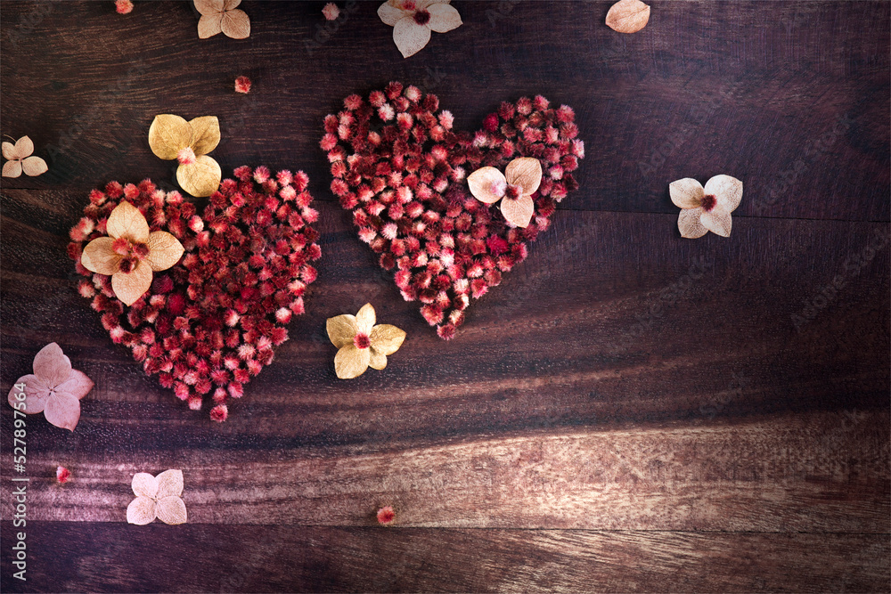 Heart of dried flowers on a wooden table Heart of dried flowers on a wooden table