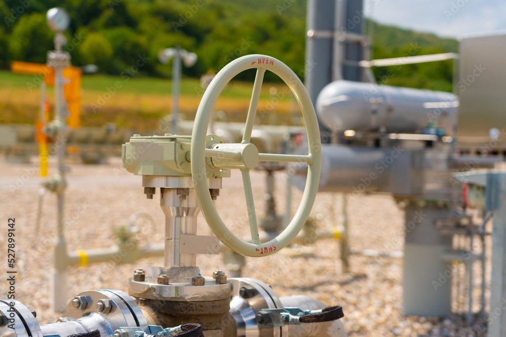 Manual faucet on a gas pipeline against the background of other gas equipment Manual faucet on a gas pipeline against the background of other gas equipment