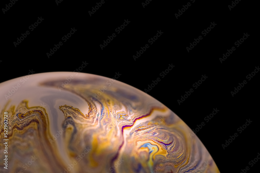 Multicolor abstract cold alien planet with an atmosphere in universe. Closeup soap bubble
