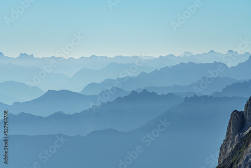 Switzerland, Panoramic view of Foggy mountain summits at dawn, near Santis © AlehAlisevich