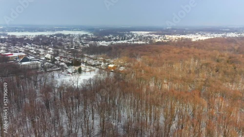 Aerial drone view, panning from left to rigt revealling part of the city of Fabreville, Laval and the Bois de la Source photo