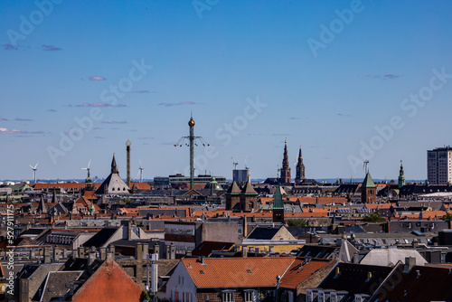 Copenhagen, Denmark, The city skyline on a sunny day and Tivoli Gardens in the distance.