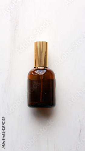 Brown transparent bottles with a gold cap. Bottles with perfume