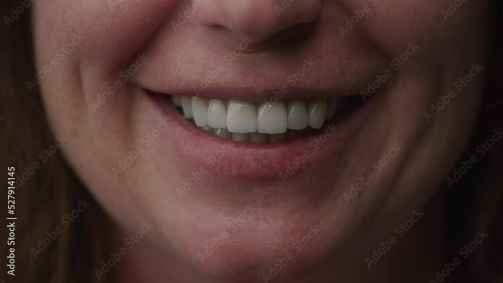 Close up perfect smile of a senior caucasian woman in slow motion Close up perfect smile of a senior caucasian woman in slow motion