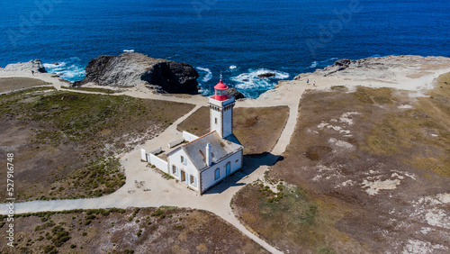 Aerial view of the Pointe des Poulains, the western tip of Belle-île-en-Mer, the largest island of Brittany in Morbihan, France - Phare des Poulains lighthouse with a red dome in the Atlantic Ocean