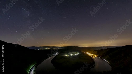 nightscape, night full of stars, milkyway behind a loop or curve of the river Saar close to the city Saarburg in Rheinland-Pfalz, Germany