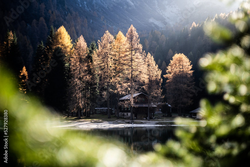 Scenic view of the small houses near the mountain refuge at Nambino Lake, Northern Italy photo