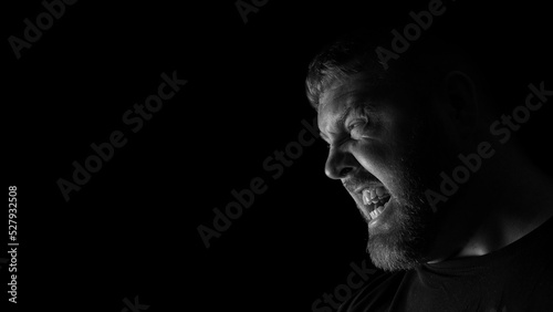 фотографія Angry looking Caucasian adult male looking sideways.