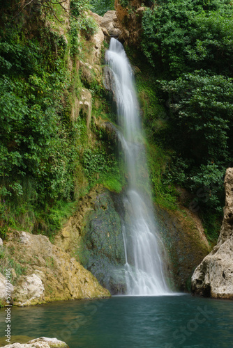 Fototapeta Naklejka Na Ścianę i Meble -  waterfall over a natural pool for bathing in cold and crystalline