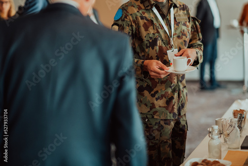 Close-up photo of soldier serving themselves in a modern hotel during a dinner party. Selective focus 
