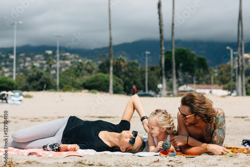 A family having fun on a sunny beach in Anaheim California, USA photo