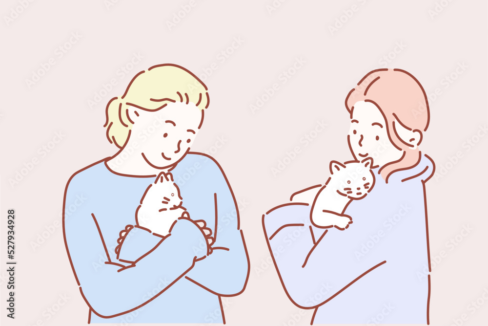 Young women holds in her arms and hugs cat. Young women holds in her arms and hugs cat.