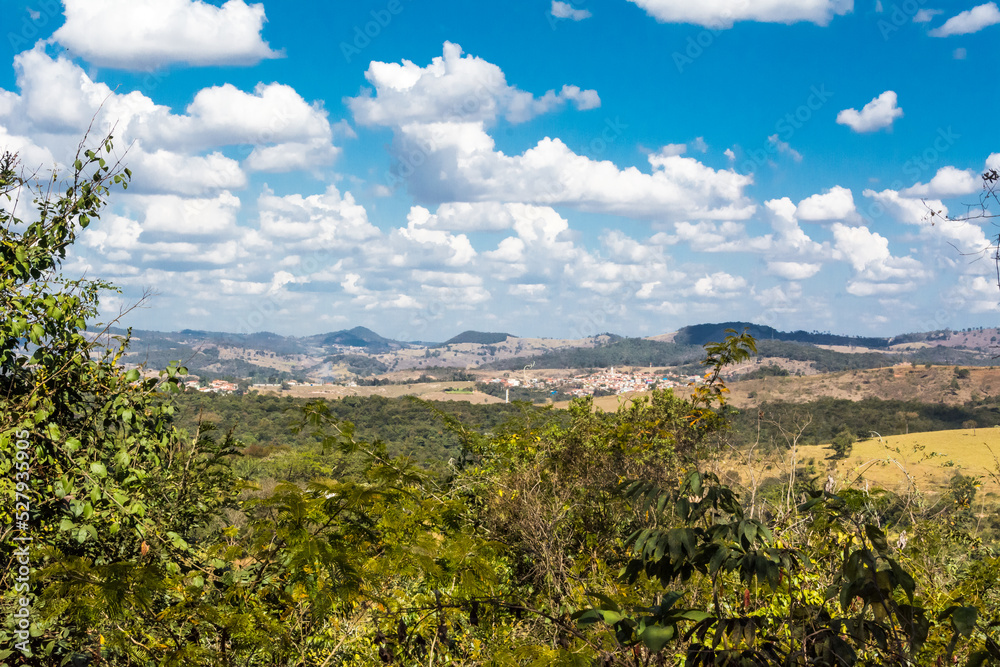 Landscape of the field with vegetation and blue sky with clouds at Brumadinho, State of Minas Gerais, Brazil.