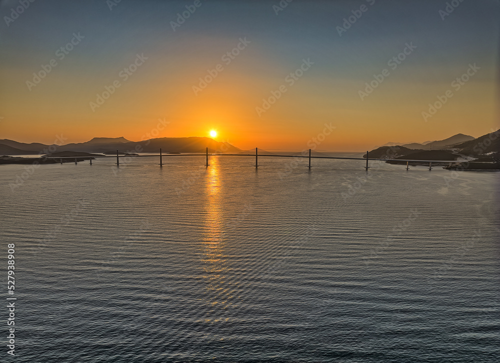 Aerial view of the Peljesac bridge at sunset