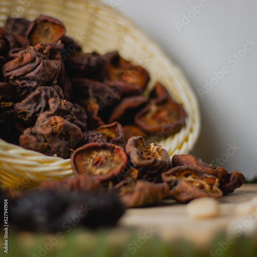 Dried wild pears in bowl, side view photo