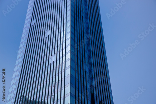 Detail of skyrise building with blue sky photo