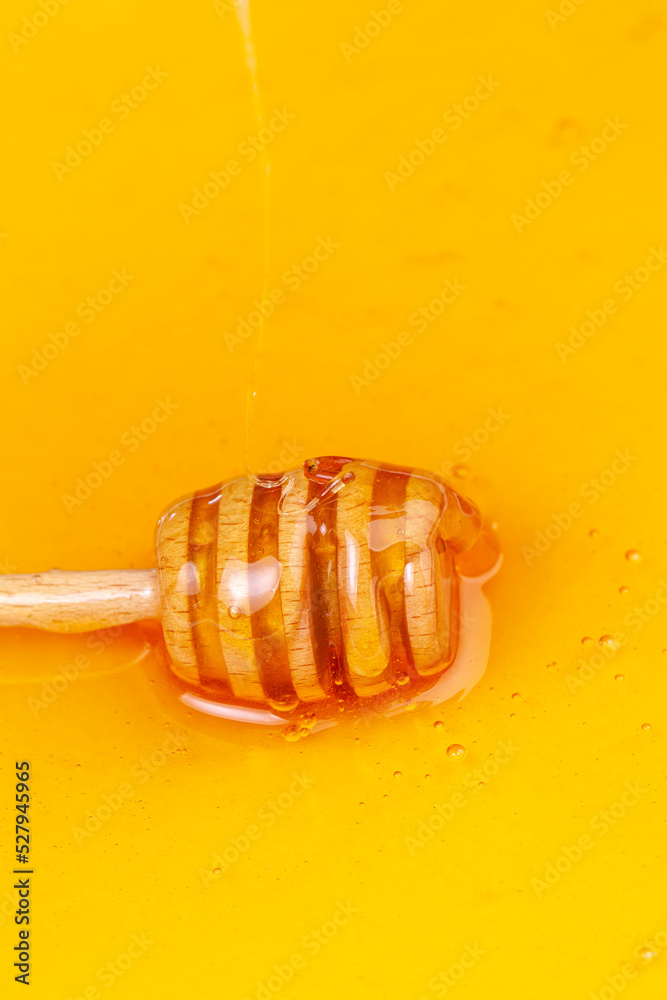 Sweet bee honey in a transparent glass jar Sweet bee honey in a transparent glass jar