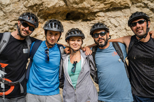 portrait of group of people wear protective helmet during bike ride photo