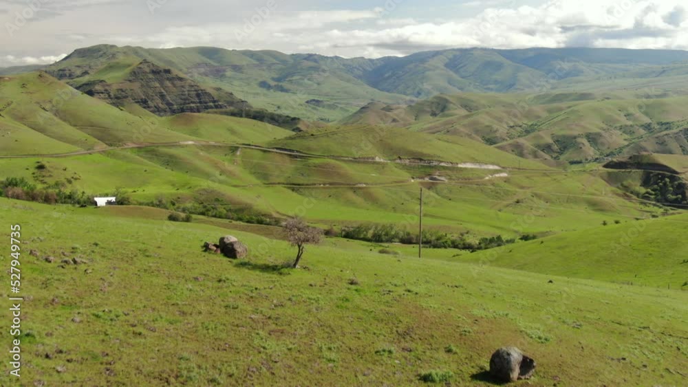 Aerial of green rural Idaho rolling hillsides and farms near Hells Canyon in springtime Aerial of green rural Idaho rolling hillsides and farms near Hells Canyon in springtime